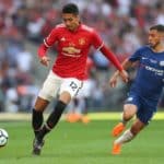 Manchester United's Chris Smalling and Eden Hazard of Chelsea battle for the ball.