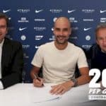 Pep Guardiola signing a contract extension at Manchester City