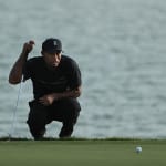 Woods survives, Oosthuizen on point