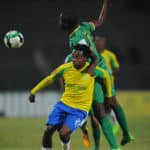 Percy Tau of Mamelodi Sundowns is challenged by Olaleng Shaku of Baroka