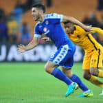 Michael Boxall challenged by George Lebese