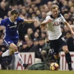 Cesar Azpilicueta vies for the ball with Harry Kane