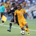 Siphiwe Tshabalala challenged by Innocent Maela