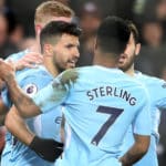 Sergio Aguero celebrates with teammates after scoring his third goal