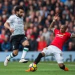 Mohamed Salah of Liverpool takes on Ashley Young of Manchester United