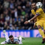 Medhi Benatia of Juventus brings down Lucas Vasquez of Real Madrid.