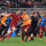 Roma's Kostas Manolas celebrates with teammates after scoring