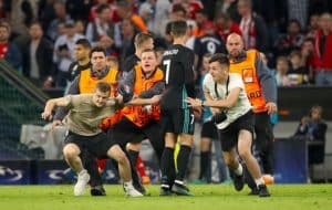 Read more about the article Uefa charges Bayern Munich over pitch invasion and banner