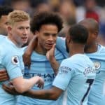 Manchester City celebrate scoring their first goal of the game.