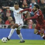 Roma's Juan Jesus and Liverpool's Mohamed Salah in action