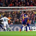 Real Madrid's forward Cristiano Ronaldo scores against Barcelona.