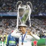 Real Madrid's Cristiano Ronaldo celebrates with the UCL trophy.