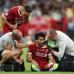 Liverpool's Mohamed Salah reacts after picking up an injury during the UEFA Champions League Final.