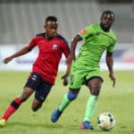 Tebogo Tlolane challenges Wangu Gome for the ball