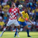 Brazil's Taison in action with Croatia’s Dejan Lovren.
