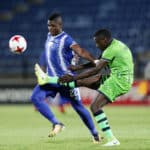 Willem Mwedihanga clears ball from Mohau Mokate