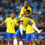 Paulinho, Silva help Brazil clinch top spot