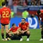 Players of Spain react after losing to Russia on penalties.