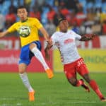 Ricardo Nascimento is challenged by Sabelo Nyembe