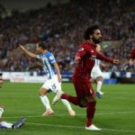 Salah guides Liverpool past Huddersfield
