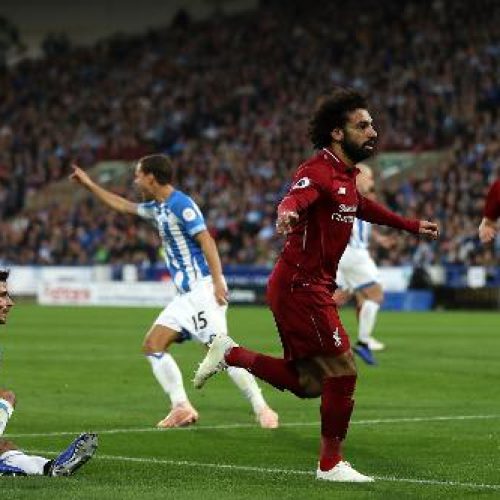 Salah guides Liverpool past Huddersfield