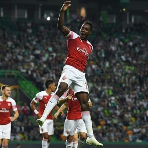 Welbeck goal guides Arsenal past Sporting