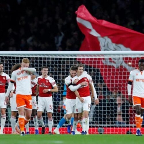 Arsenal edge Blackpool in feisty affair