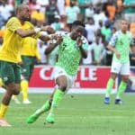 Ahmed Musa of Nigeria challenged by Tiyani Mabunda of Bafana Bafana