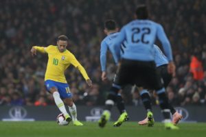 Read more about the article Neymar guides Brazil past Uruguay