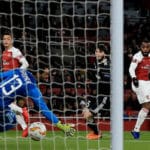 Lacazette on target as Saka shines