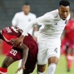 Bolaji Sakin of Horoya challenged by Happy Jele of Orlando Pirates