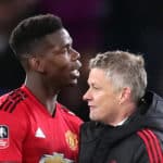 Manchester United's Paul Pogba and caretaker manager Ole Gunnar Solskjaer