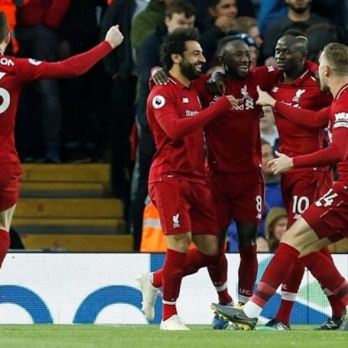 Liverpool smash Huddersfield to go back top