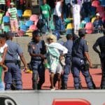 Police escorting Bloemfontein Celtic supporters off the field