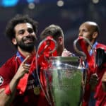 Liverpool's Mohamed Salah celebrates with the trophy after the UEFA Champions League Final at the Wanda Metropolitano, Madrid.