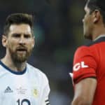 Argentina's Lionel Messi, left, complains to to the referee