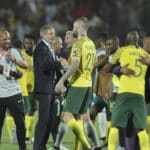 Bafana Bafana head coach Stuart Baxter celebrates with his player after beating Egypt