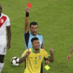 Referee Roberto Tobar shows the red card to Gabriel Jesus of Brazil