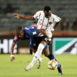 Justin Shonga of Orlando Pirates challenged by Bandile Shandu of Maritzburg United