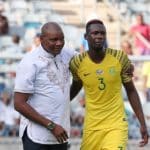 Molefi Ntseki, coach of Bafana Bafana with defender Eric Mathoho