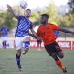 Jose Meza of Maritzburg United challenged by Thulani Hlatshwayo of Orlando Pirates