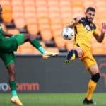 Daniel Cardoso of Kaizer Chiefs challenged by Basil Mpahlele of Baroka