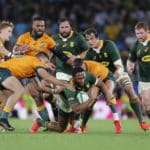 epa09463220 Tom Banks (L) and Quade Cooper (R) of Australia tackle Lukhanyo Am (C) of South Africa during the Rugby Championship Round 3 match between South Africa's Springboks and Australia's Wallabies at CBus Stadium, Gold Coast, Queensland, Australia, 12 September 2021. EPA/REGI VARGHESE AUSTRALIA AND NEW ZEALAND OUT
