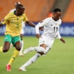Khama Billiat of Zimbabwe challenged by Nyiko Mobbie of South Africa during the 2022 World Cup Qualifier Bafana