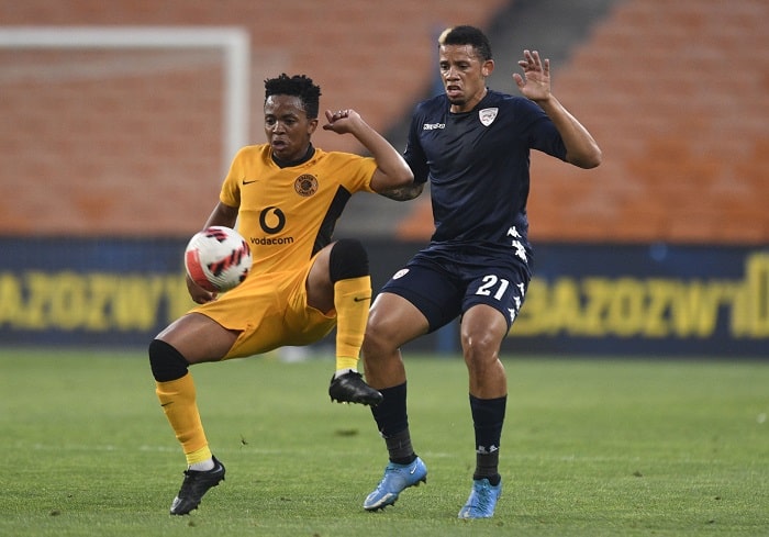 Cheslyn Jampies of Sekhukhune United FC challenges Nkosingiphile Ngcobo of Kaizer Chiefs
