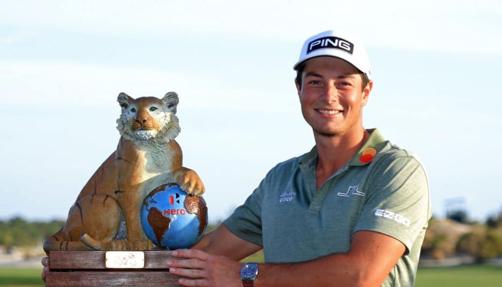 NASSAU, BAHAMAS - DECEMBER 05: Viktor Hovland of Norway poses with the trophy after winning the Hero World Challenge at Albany Golf Course on December 05, 2021 in Nassau, . (Photo by Mike Ehrmann/Getty Images)
