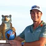 NASSAU, BAHAMAS - DECEMBER 05: Viktor Hovland of Norway poses with the trophy after winning the Hero World Challenge at Albany Golf Course on December 05, 2021 in Nassau, . (Photo by Mike Ehrmann/Getty Images)