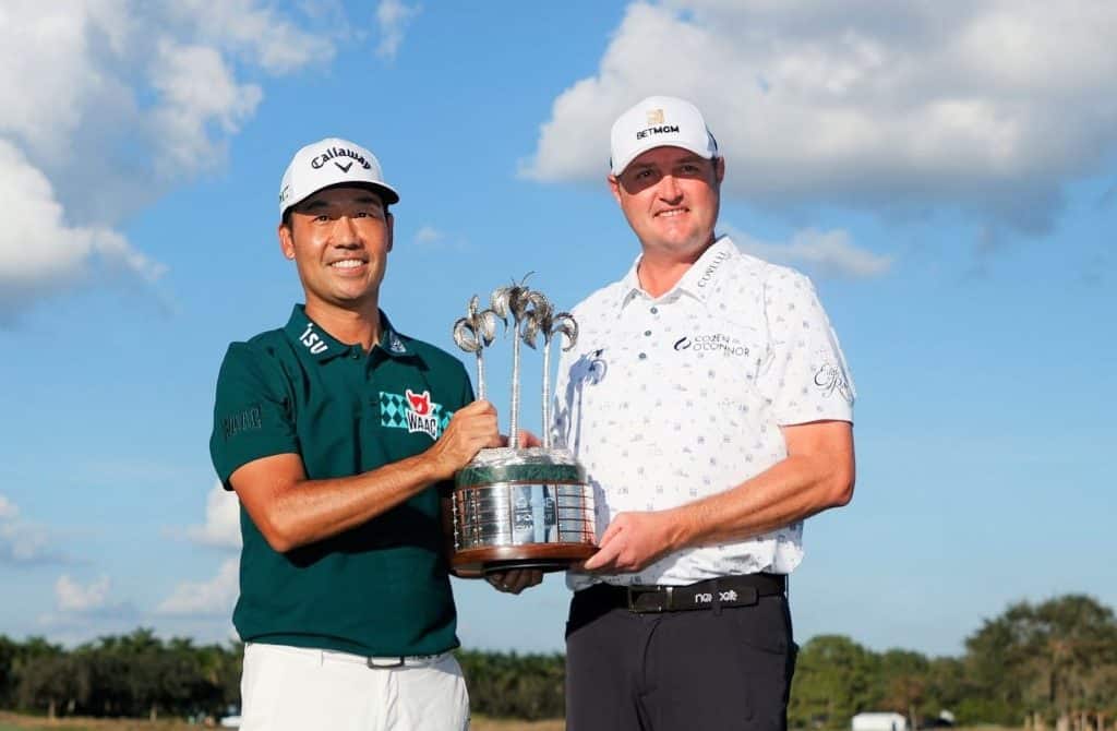 NAPLES, FLORIDA - DECEMBER 12: Jason Kokrak of the United States and Kevin Na of the United States celebrate with the trophy on the 18th green after winning during the final round of the QBE Shootout at Tiburon Golf Club on December 12, 2021 in Naples, Florida. (Photo by Cliff Hawkins/Getty Images)
