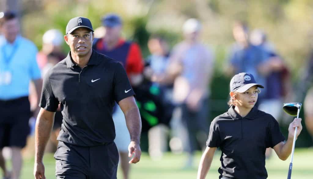 ORLANDO, FLORIDA - DECEMBER 17: Tiger Woods and Charlie Woods walk during the Pro-Am ahead of the PNC Championship at the Ritz Carlton Golf Club Grande Lakes on December 17, 2021 in Orlando, Florida. (Photo by Douglas P. DeFelice/Getty Images)