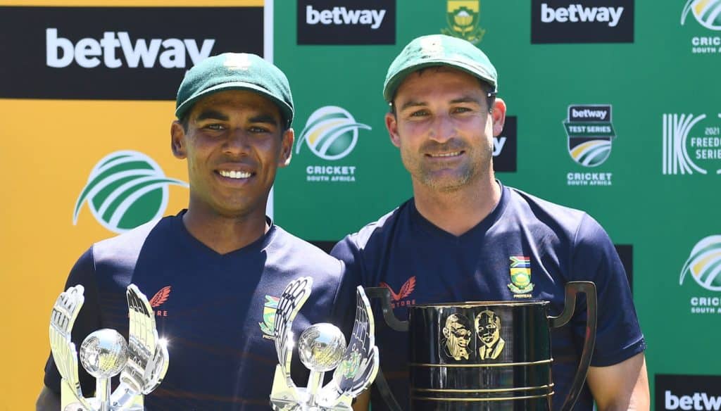 CAPE TOWN, SOUTH AFRICA - JANUARY 14: Keegan Peterson pose the Man of the Match and the Series trophies and Dean Elgar (captain) of South Africa with the Freedom trophy during day 4 of the 3rd Betway WTC Test match between South Africa and India at Six Gun Grill Newlands on January 14, 2022 in Cape Town, South Africa. (Photo by Ashley Vlotman/Gallo Images)